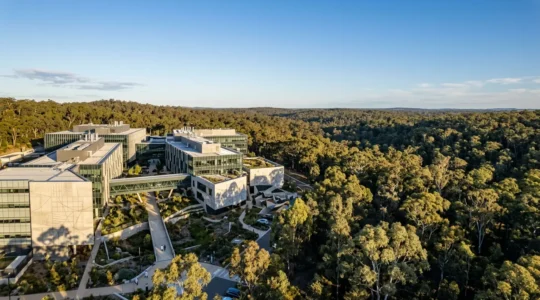Aerial view of Australian medical research facility with modern architecture surrounded by native landscape