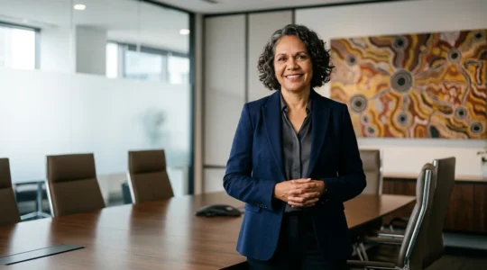 Professional presenting acknowledgement of country in modern boardroom setting