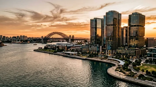 Sydney financial district overlooking harbor with modern office towers representing Asia-Pacific business connections
