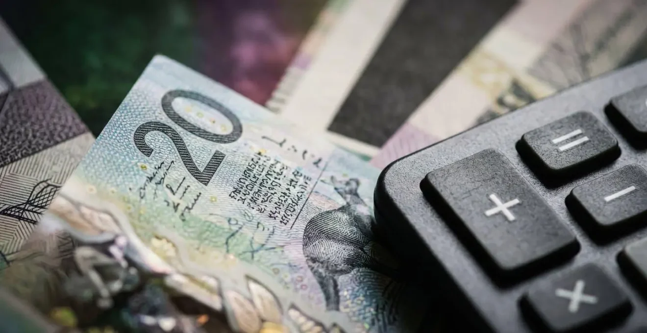 Close-up of insurance documents with calculator and Australian dollars